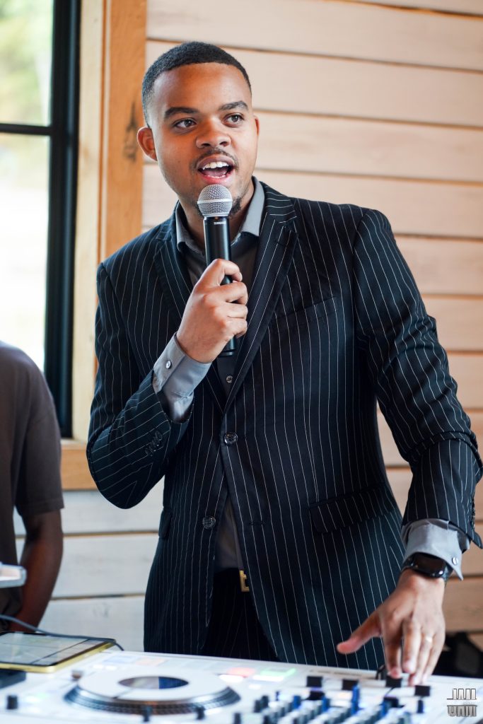 DJ Tycoon at a wedding reception working the crowd.