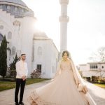 bride spinning showing off wedding dress to groom