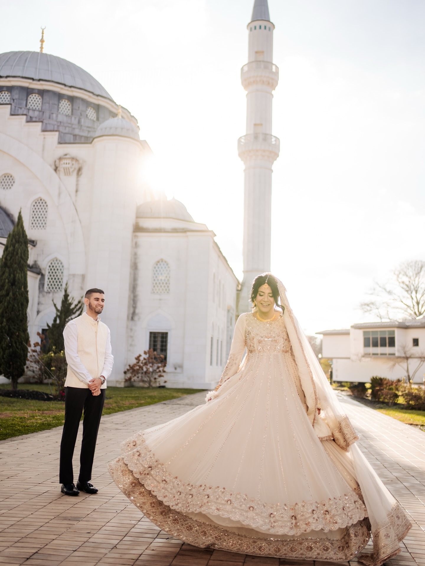 bride spinning showing off wedding dress to groom