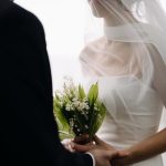 Bride and groom looking at each other during couples portrait session