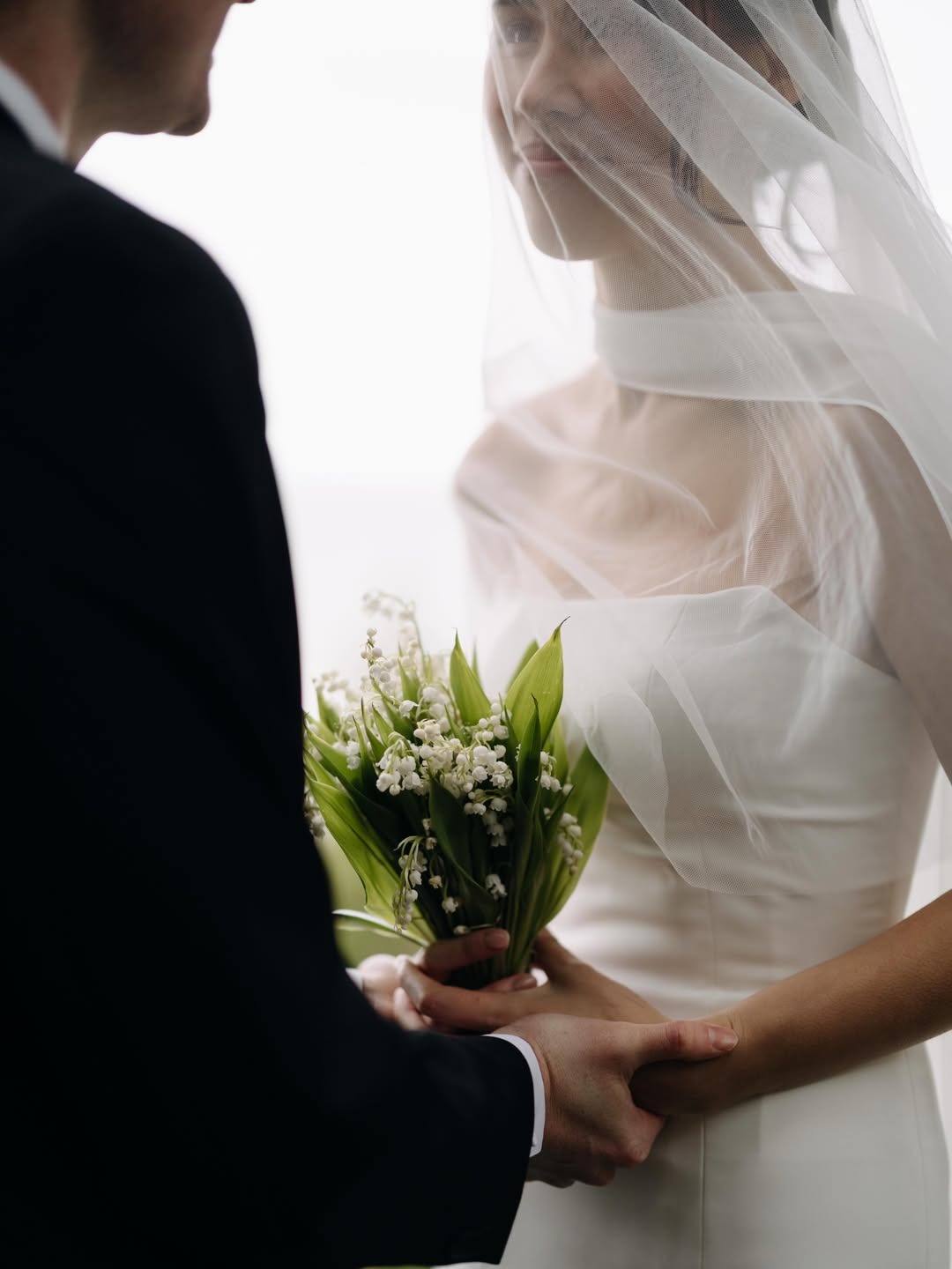 Bride and groom looking at each other during couples portrait session