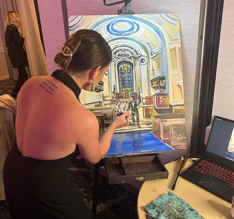 painter at wedding reception experiential wedding vendor