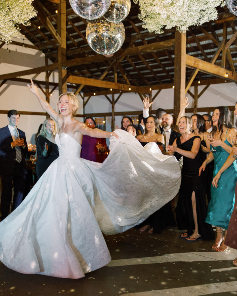 bride dancing reception with friends disco ball wedding great marsh estate