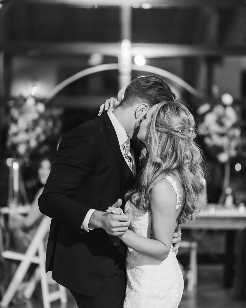 Bride and groom during their first dance in the main venue at Knotting Hills Wedding Venue & Resort.