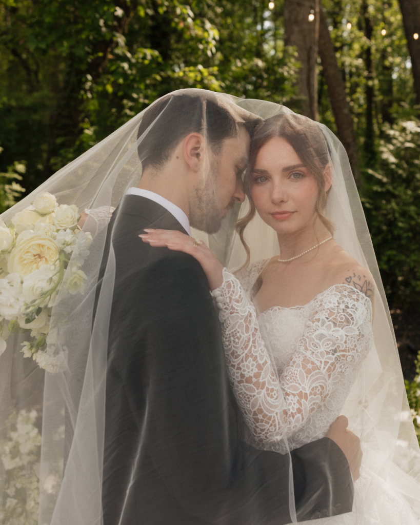 Fine art wedding photography inspiration highlighting an off-the-shoulder lace wedding dress and classic bridal veil.