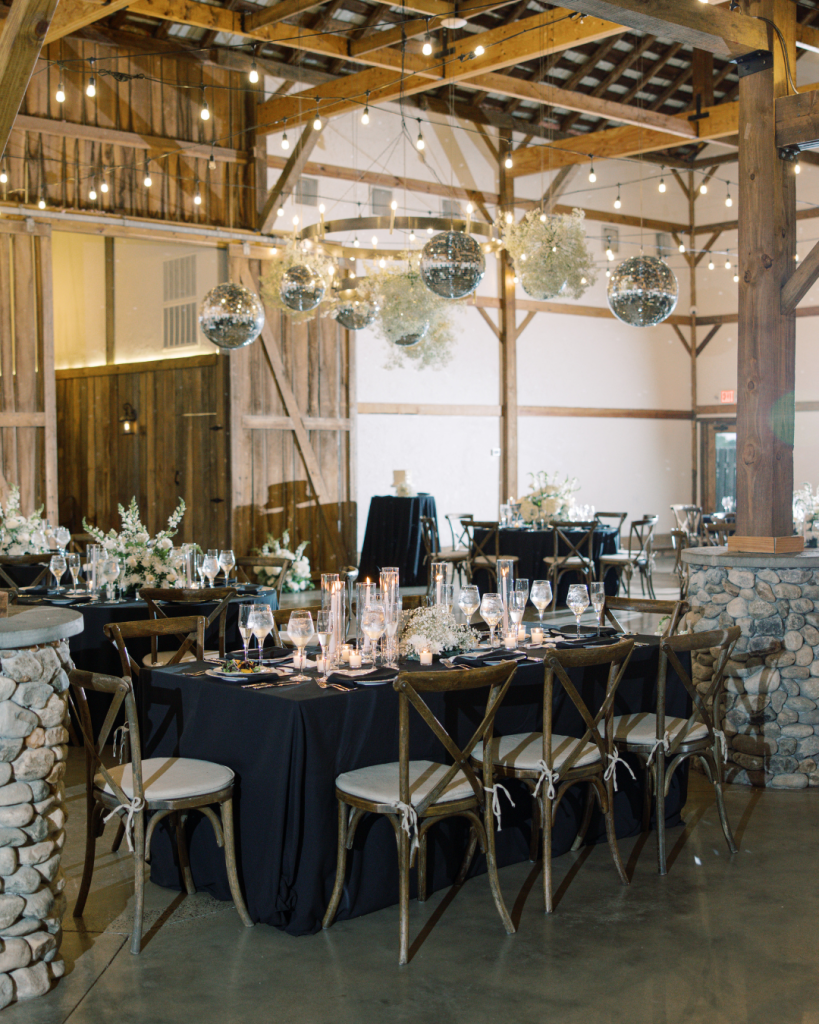 timeless wedding reception long table disco ball great marsh estate
