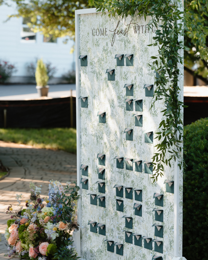 large guest seating chart that had hand written letters to every guest that attending the wedding