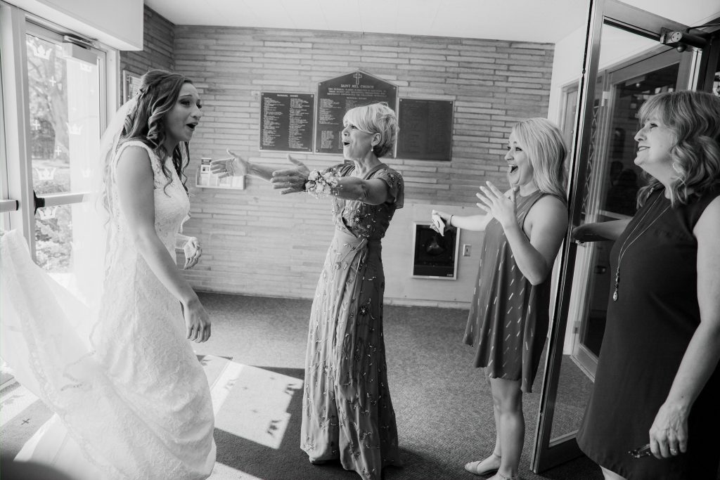 Bride sharing an emotional reunion with family members before the wedding ceremony.