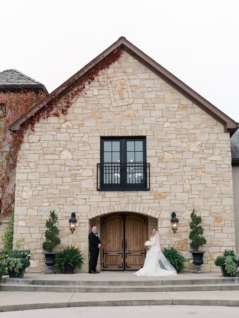 Bride and groom taking portraits outside Silver Oaks Chateau.