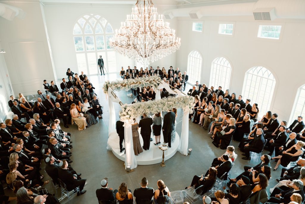 Overhead photo of a wedding reception set up with center decor by Exclusive Events, Inc.