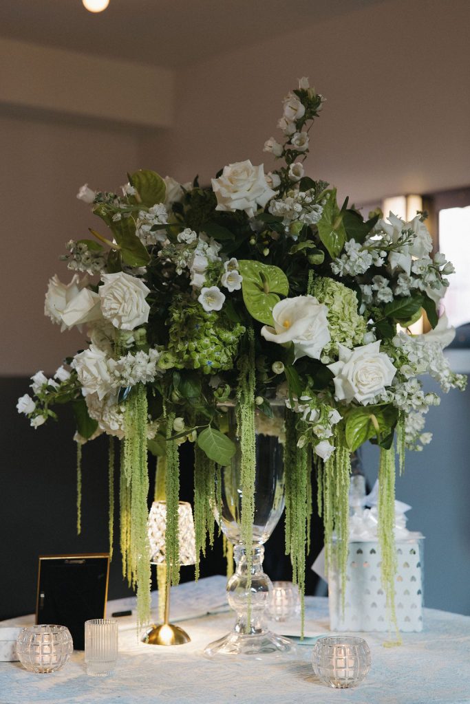 Reception details featuring a large floral centerpiece for a reception coordinated by Coordinating with Catherine.