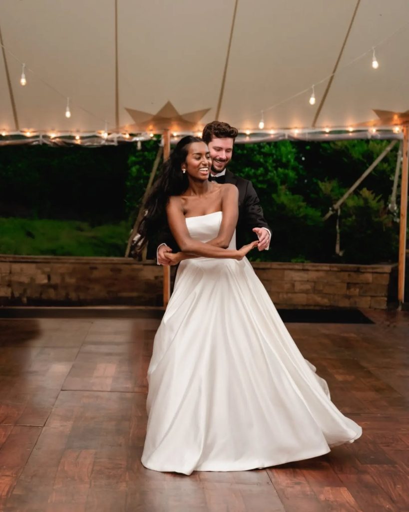 bride and groom dancing choreographed first dance song northern virginia wedding venue outdoor thunderstorm rain plan