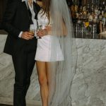 bride and groom kissing at wedding reception bar in northern virginia