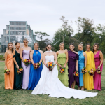 Bridesmaids standing together with bride. Makeup and hair done by LUX Studio.