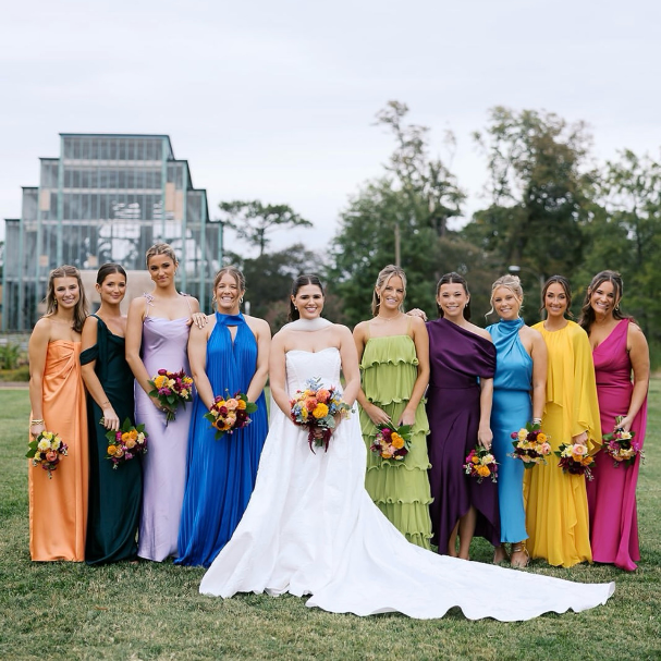 Bridesmaids standing together with bride. Makeup and hair done by LUX Studio.