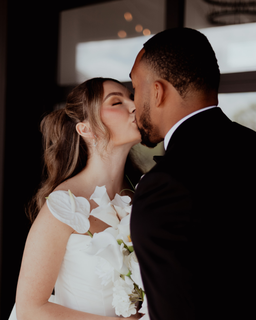 TreVeyon and Kenzie share a kiss during their wedding portraits at Twin Run Farm.