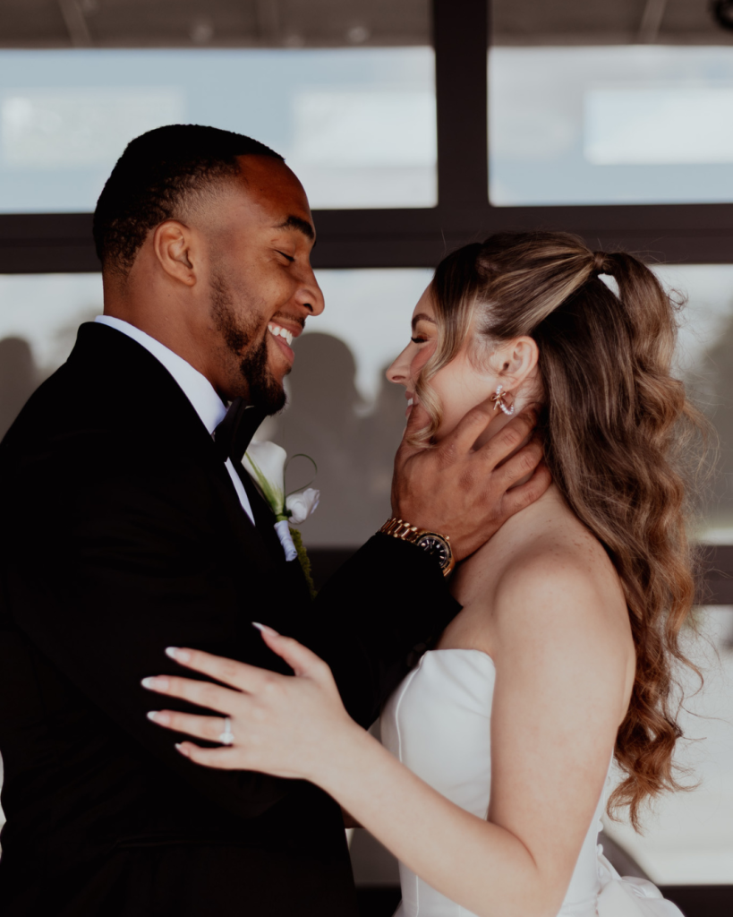 TreVeyon and Kenzie smile together during an intimate wedding portrait.