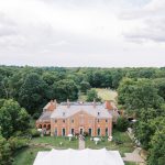 Aerial view of an elegant outdoor wedding reception tent at Greenacres Arts Center in Cincinnati, Ohio.