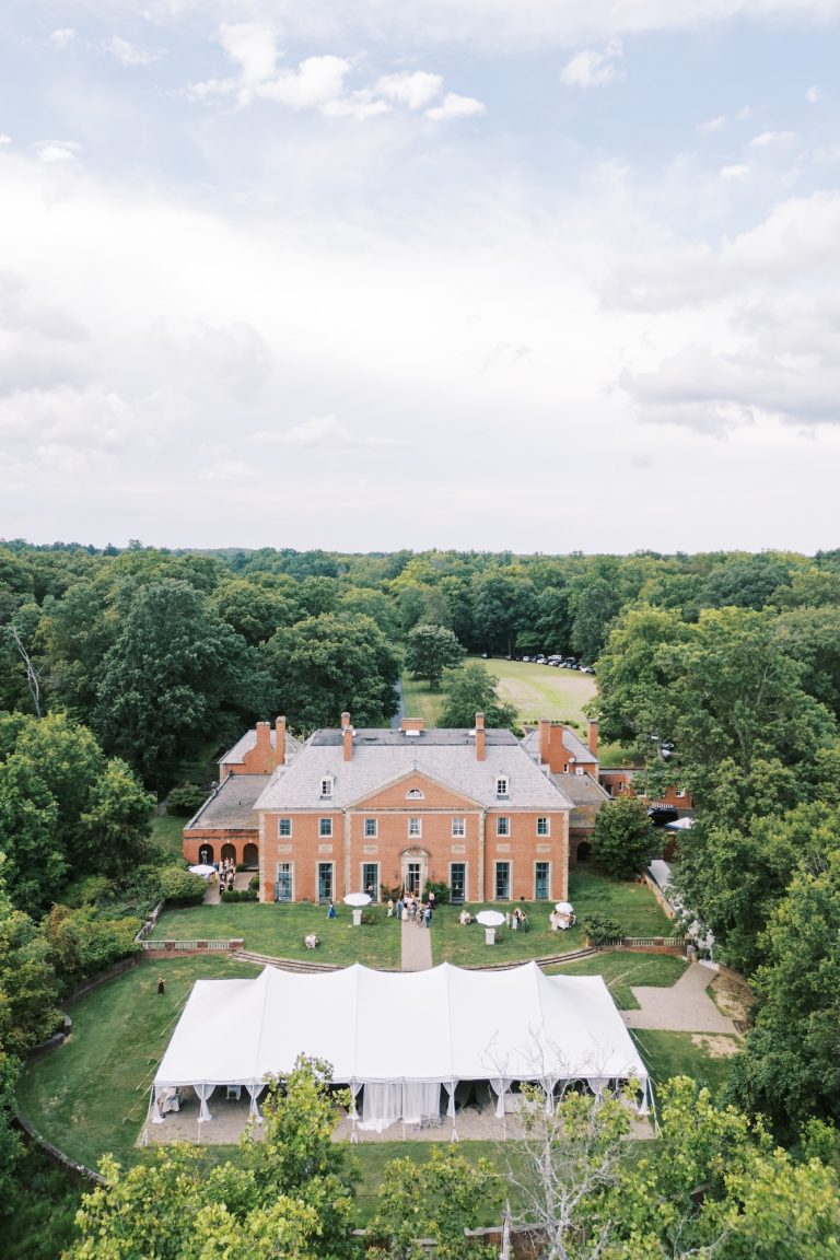 Aerial view of an elegant outdoor wedding reception tent at Greenacres Arts Center in Cincinnati, Ohio.