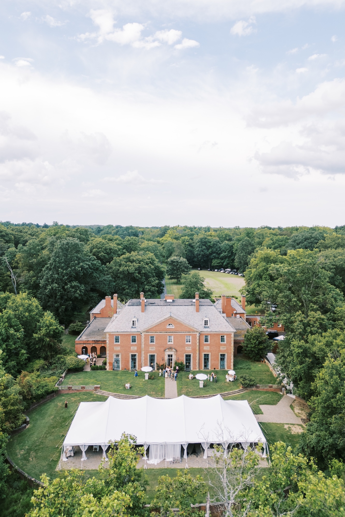 Aerial view of an elegant outdoor wedding reception tent at Greenacres Arts Center in Cincinnati, Ohio.
