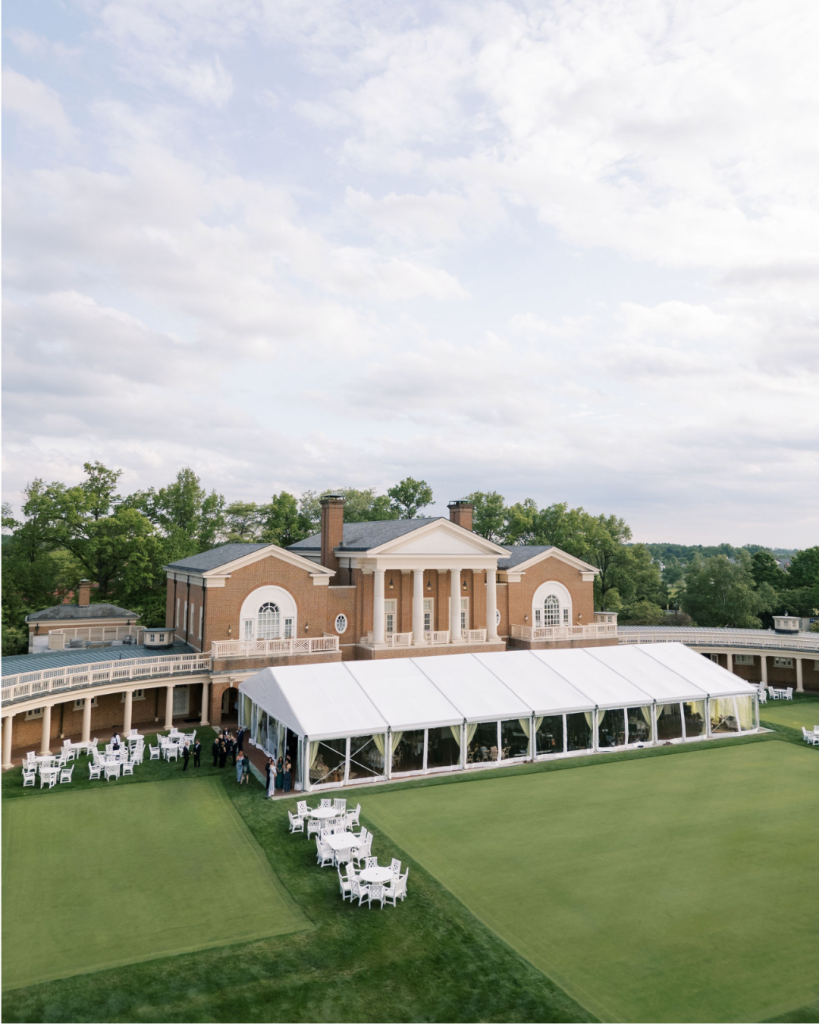 Aerial view of New Albany Country Club and the white reception tent arranged on the lawn.