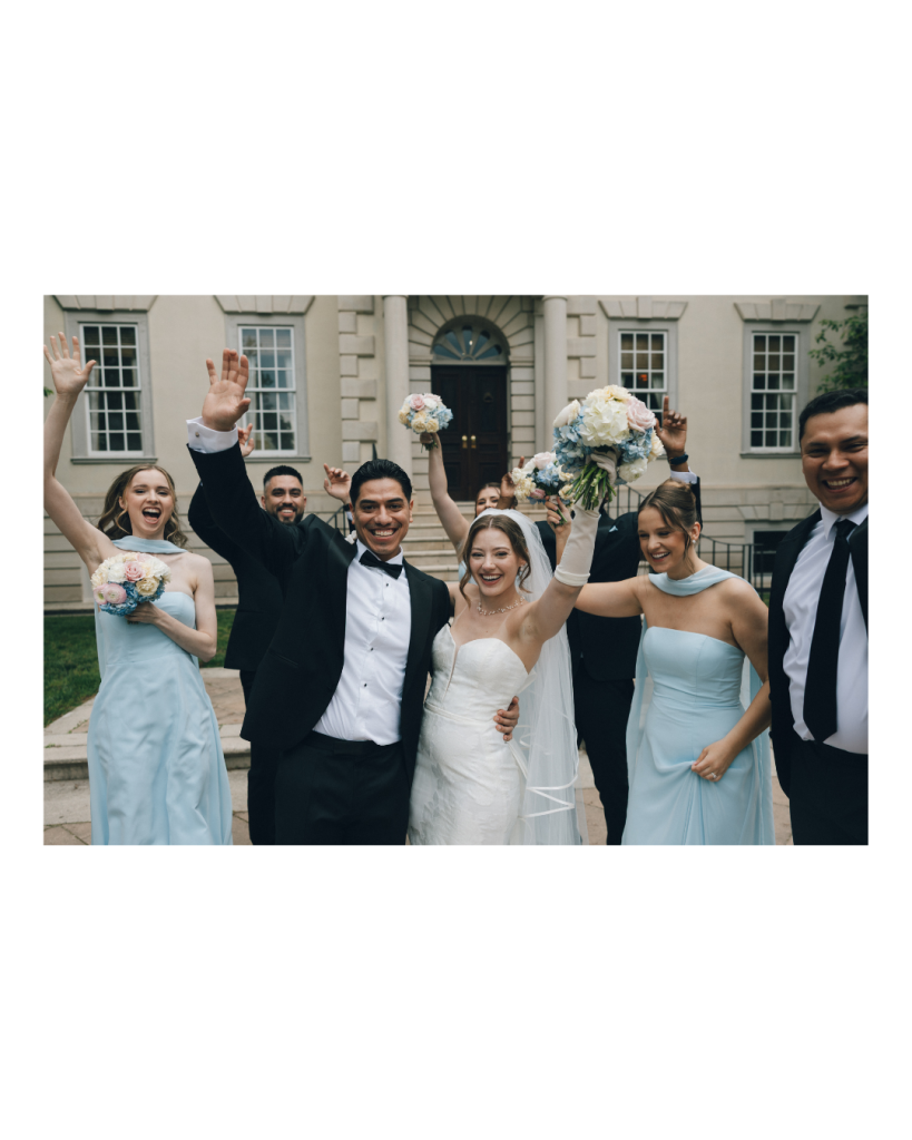 wedding party cheering together after wedding ceremony portrait session