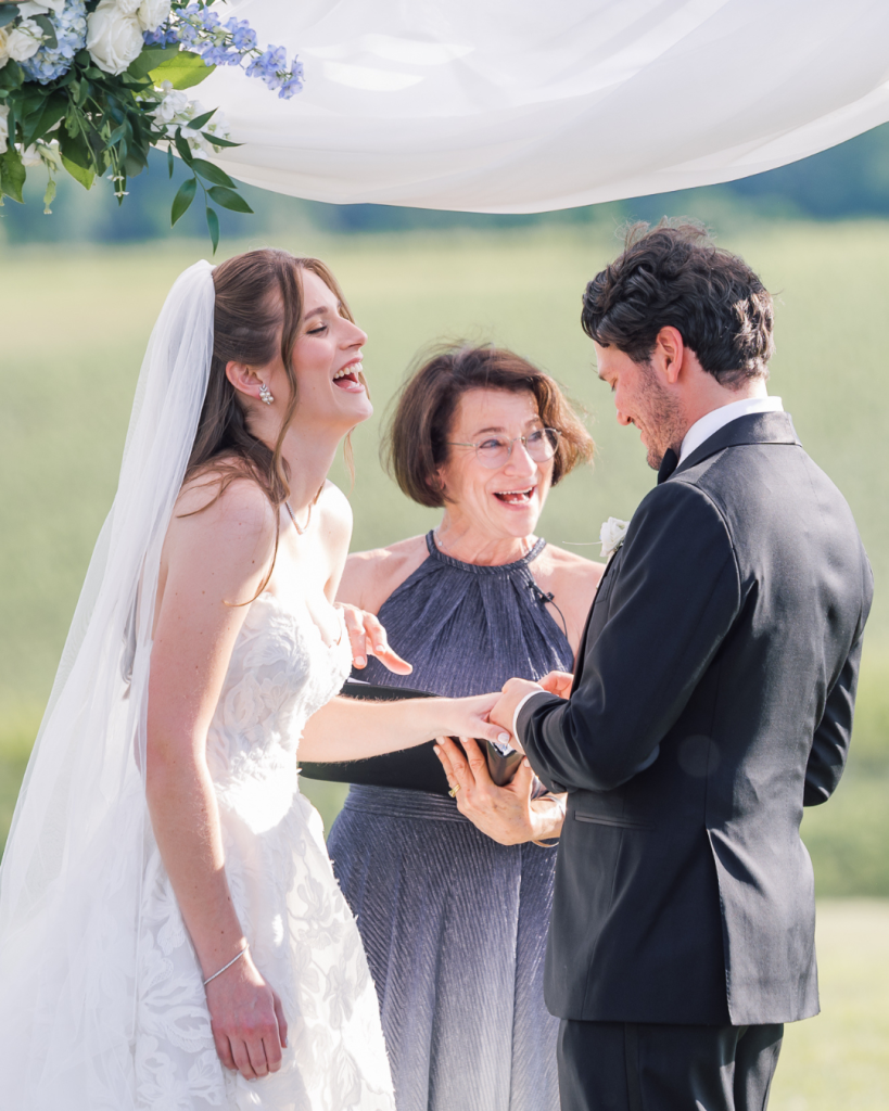 bride and groom laughing together at wedding ceremony vineyard wedding local loudoun county