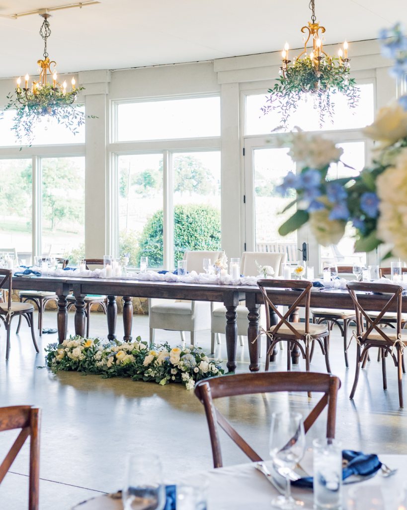 wedding reception set up near open window indoor wedding reception