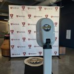 Best Booths in Town photo booth set up in front of a custom branded backdrop at a Columbus event.