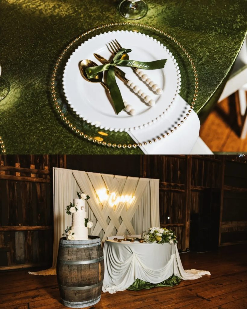 close up details of reception inside barn with white and gold sweetheart table with drapery and LED sign