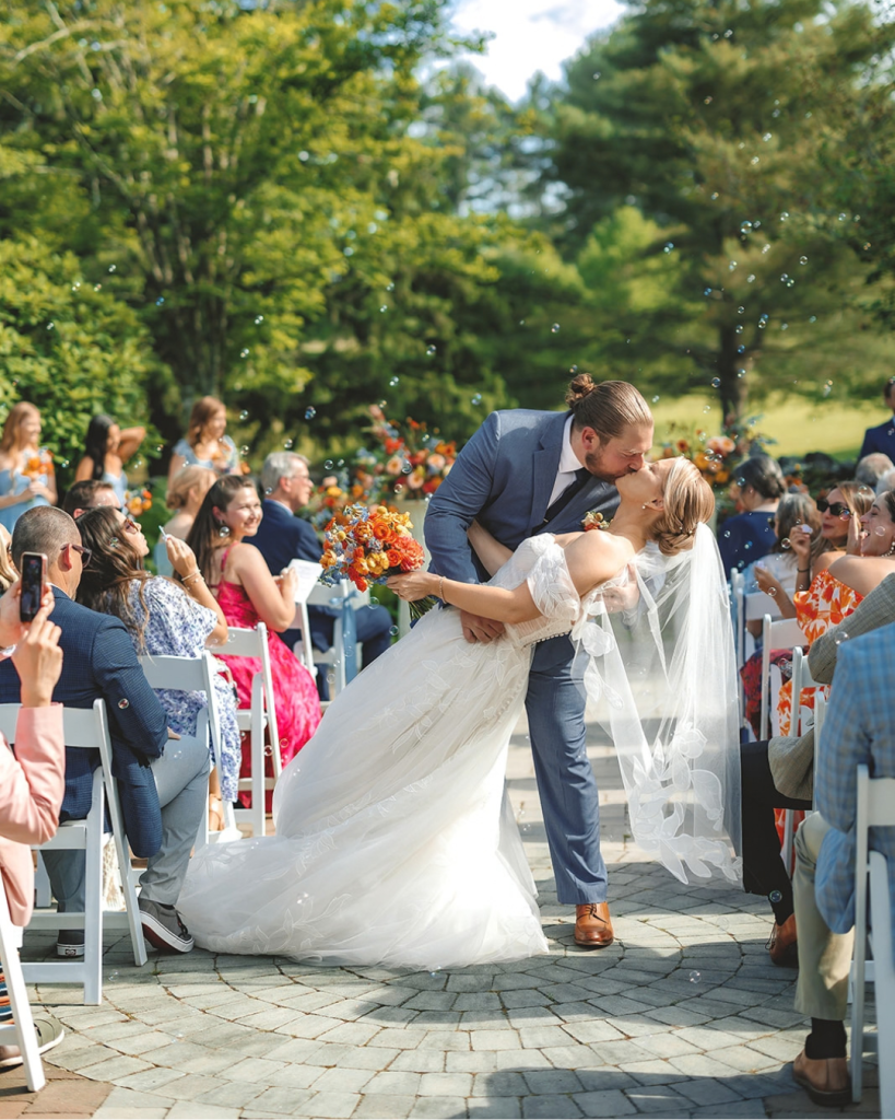 garden wedding ceremony bride and groom kiss