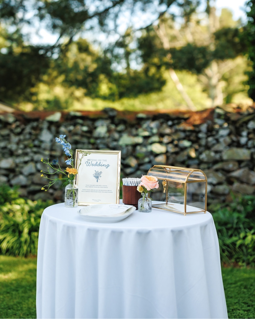 garden wedding reception with glass holder for cards