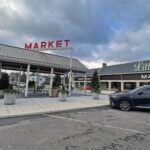 Exterior of Littleton’s Market in Upper Arlington, Ohio, featuring the market storefront, covered outdoor entrance, and red MARKET signage.