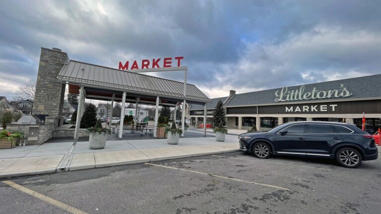Exterior of Littleton’s Market in Upper Arlington, Ohio, featuring the market storefront, covered outdoor entrance, and red MARKET signage.